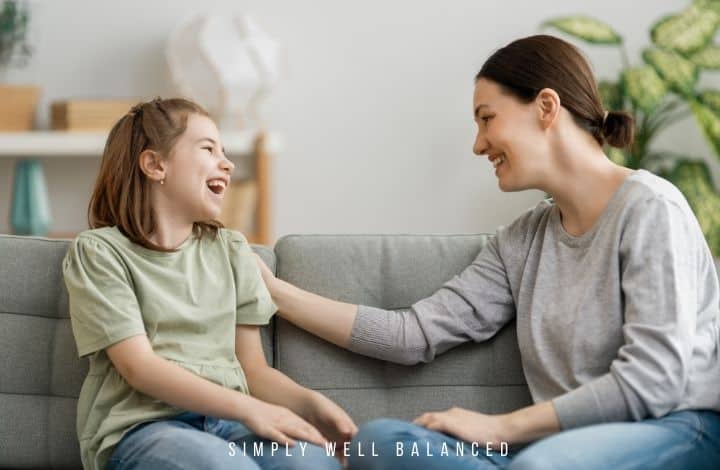Mom and daughter talking and laughing