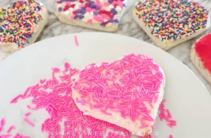 Pink jimmies on heart shaped fairy bread.