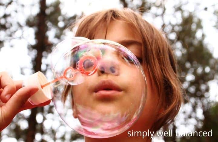outdoor activities to help kids calm down: blowing bubbles