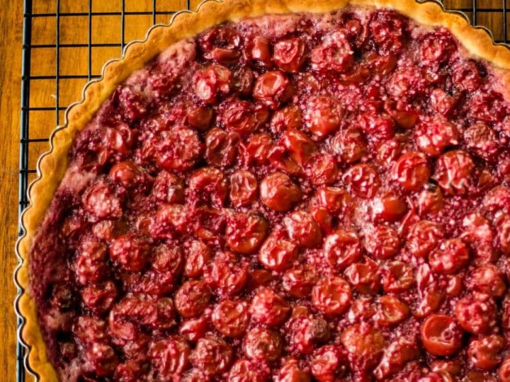 sour cherry tart on a wire rack