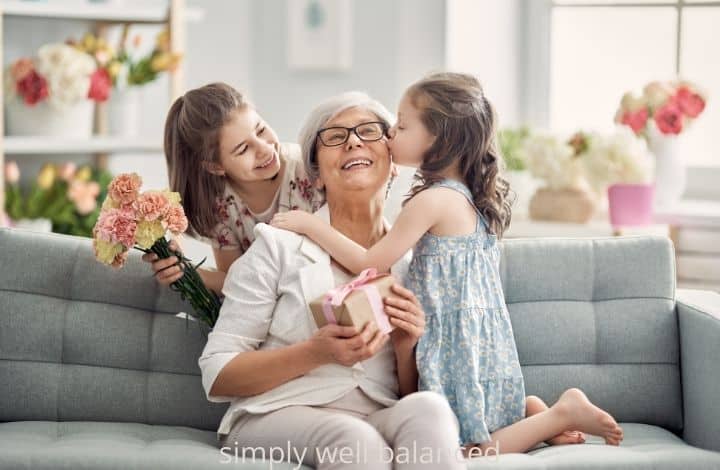Granddaughters giving a Mother's Day gift to grandma