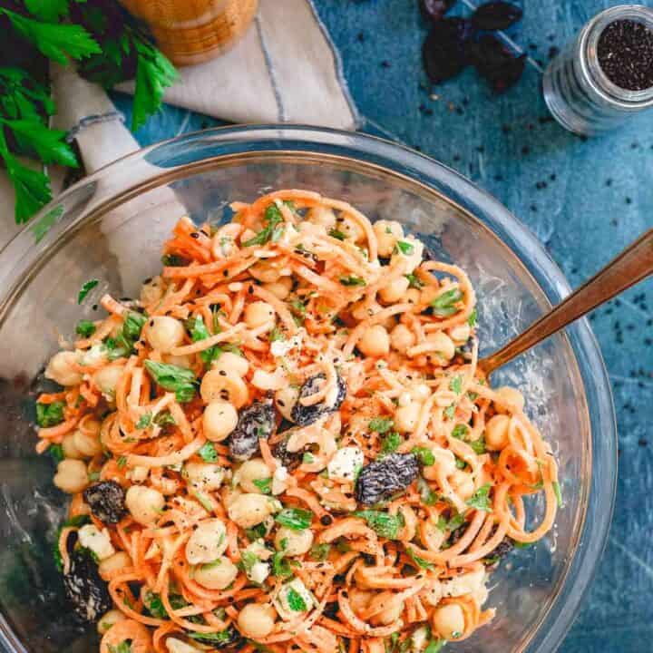 This mediterranean carrot salad is filled with chickpeas, royal raisins, feta, parsley and tossed with a creamy yogurt tahini dressing. Makes a great side salad for any cookout this summer!