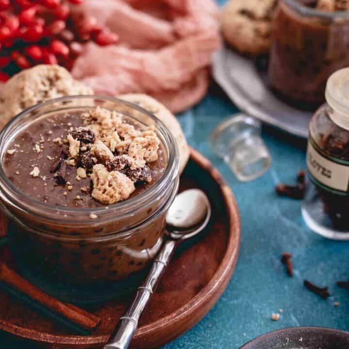 Dirty chai tapioca pudding is topped with gluten-free oatmeal raisin cookie crumble and makes a deliciously aromatic and decadent dessert.