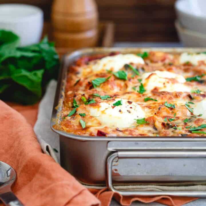 This spaghetti squash baked ziti is a healthier twist on the classic Italian dish yet still packed with that hearty, comforting and cheesy taste you love.