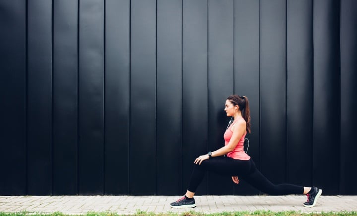 woman exercising wearing smartwatch