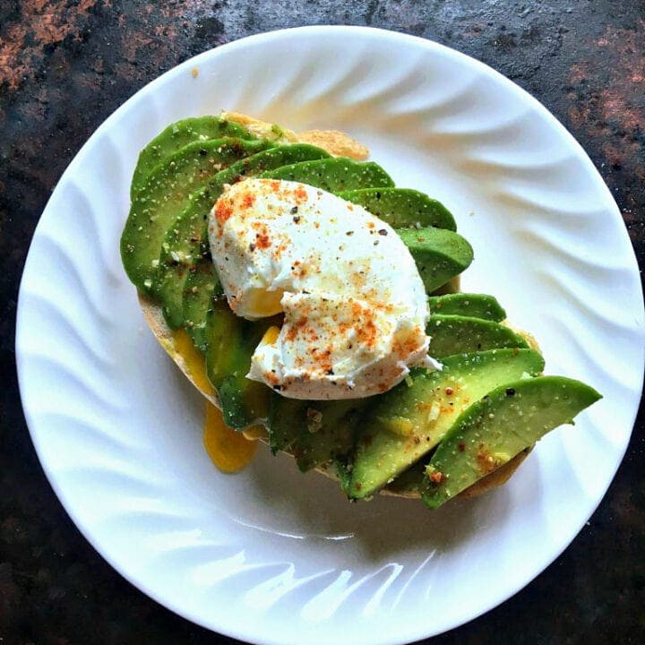 Avocado toast with lemon zest, spiced with smoked paprika, and topped with a creamy poached egg won't stop you from getting a house, promise.
