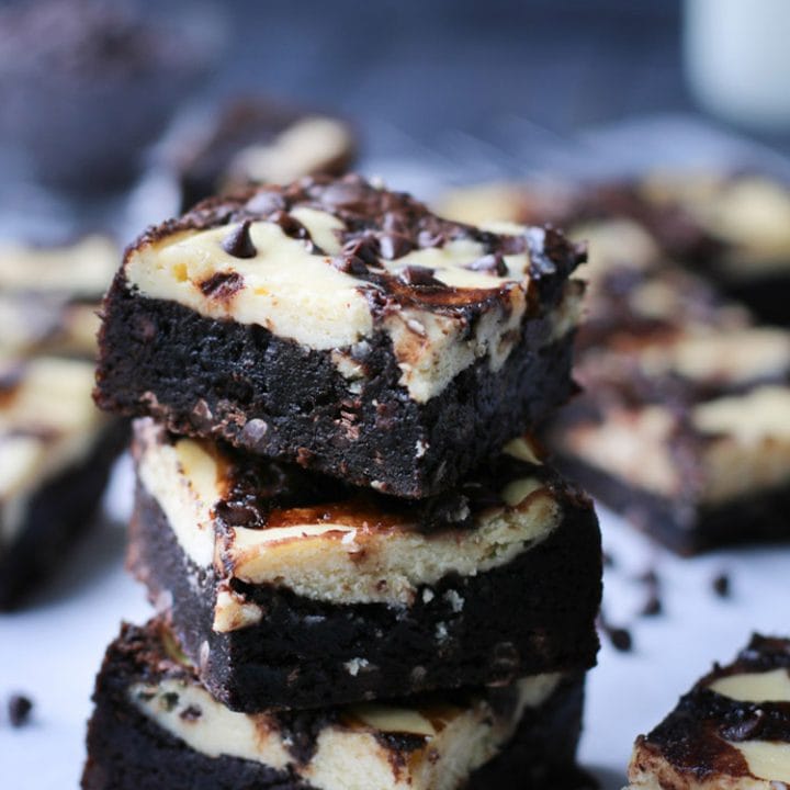 Close up photo of three stacked brownies by themerchantbaker.com