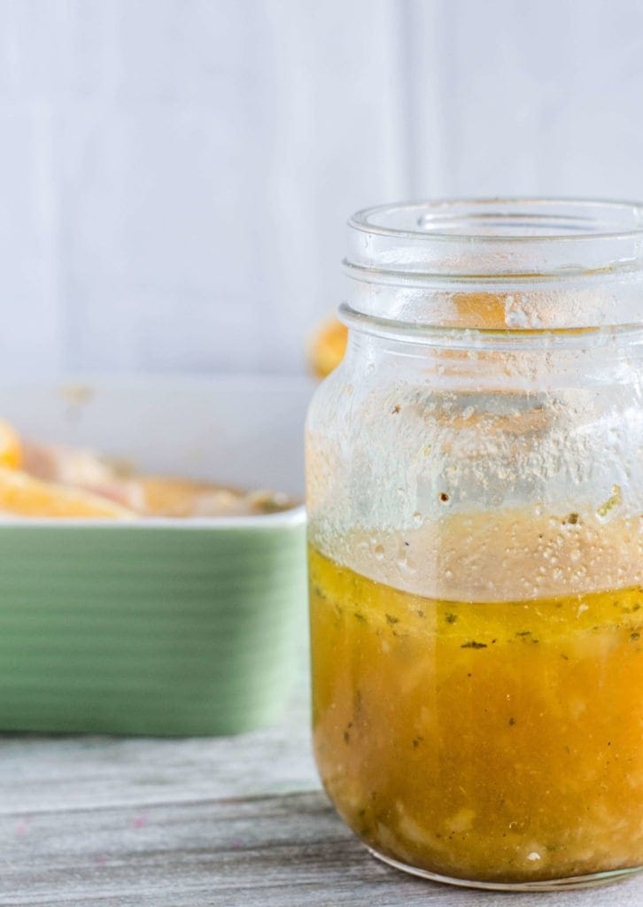 side view of a mason jar filled with mojo criollo marinade
