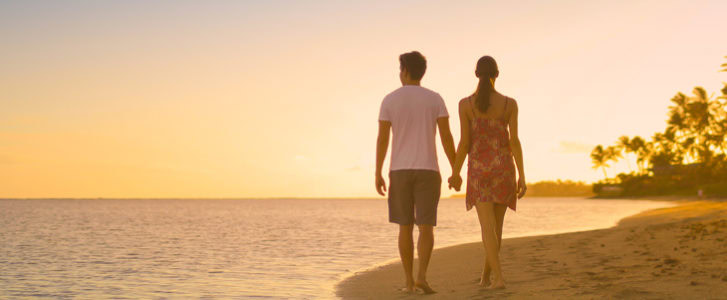 Couple walking on the beach