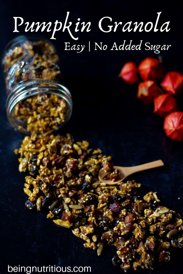 Granola spilling out of a Mason jar on a black background with text overlay: Heart Healthy Pumpkin Granola, no added sugar, easy.