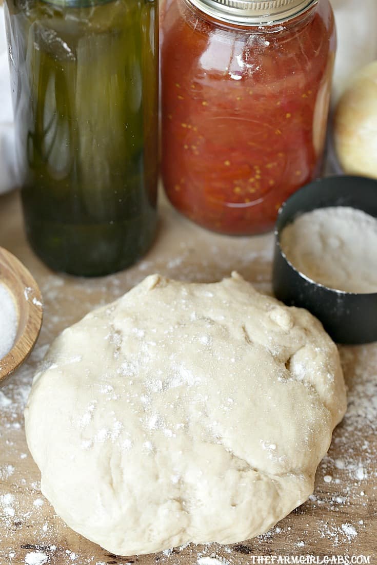 With a few simple ingredients, the Best Pizza Dough recipe is perfect for pizza night in your home! #pizza #pizzadough