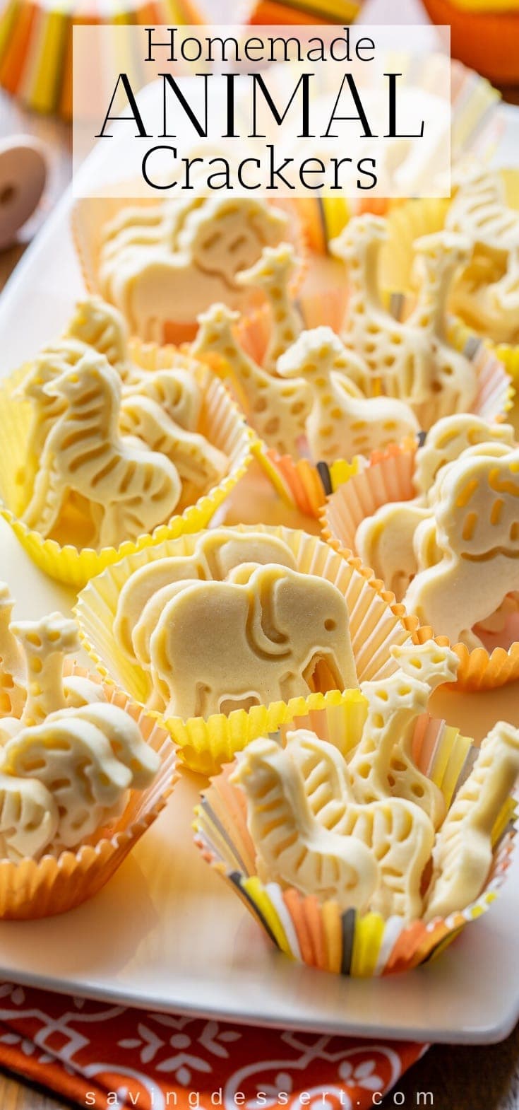 A platter of homemade animal crackers in decorative muffin cups