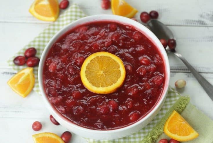 Orange Amaretto Cranberry Sauce is the perfect Thanksgiving dinner side dish. Tart cranberries, sweet orange and amaretto team up for this delicious fall recipe. This easy cranberry sauce recipe is a family favorite. It's not Thanksgiving without this delicious cranberry sauce. #cranberrysauce #orangeamarettocranberrysauce #thanksgivingsidedish