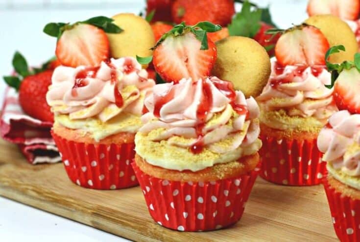 Are you fan of Strawberry cheesecake? These Strawberry cheesecake cupcakes are a fun twist on the classic. A Strawberry cupcake, fresh strawberries and a delicious cheesecake filling pair to make these delicious Strawberry Cheesecake Cupcakes. This strawberry cheesecake cupcake recipe is a real winner. Make this easy cupcake recipe for Valentine's day, birthday or just because. Celebrate strawberry season and make a batch of these pretty cupcakes.