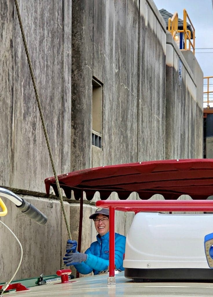 Canaller holds rope in huge concrete lock