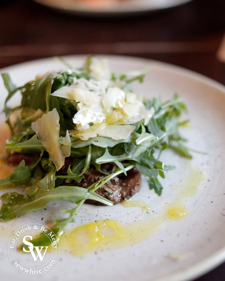 Salt and pepper seared steak with fresh rocked and flaked Lincolnshire poacher on top with a lemon dressing.