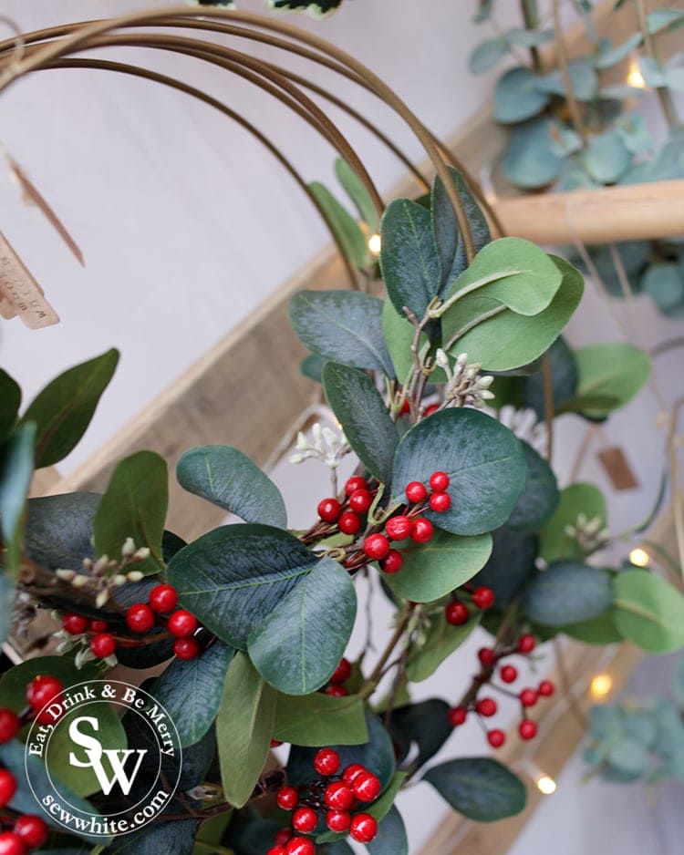 Artificial greenery and berries on a metal hoop for Christmas at the Wimbledon Winter Wonderland