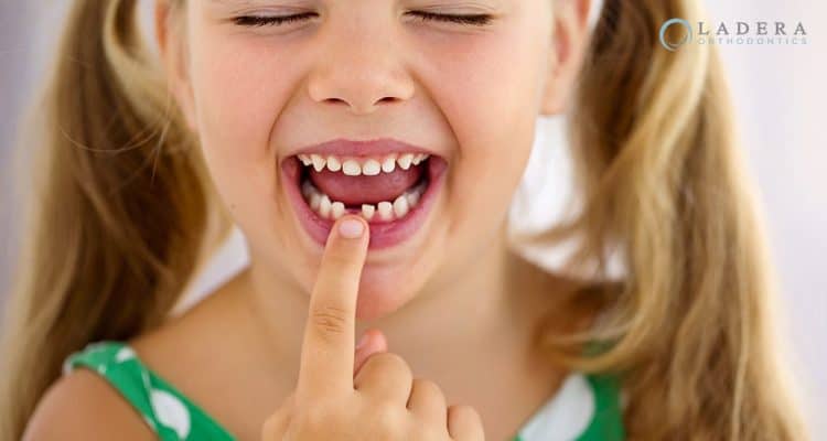 age lose first tooth