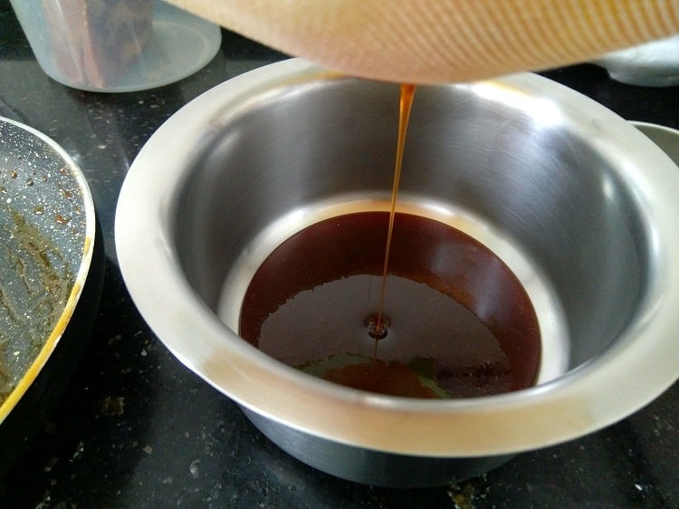 Straining the jaggery for impurities