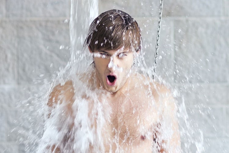 a guy taking a cold shower