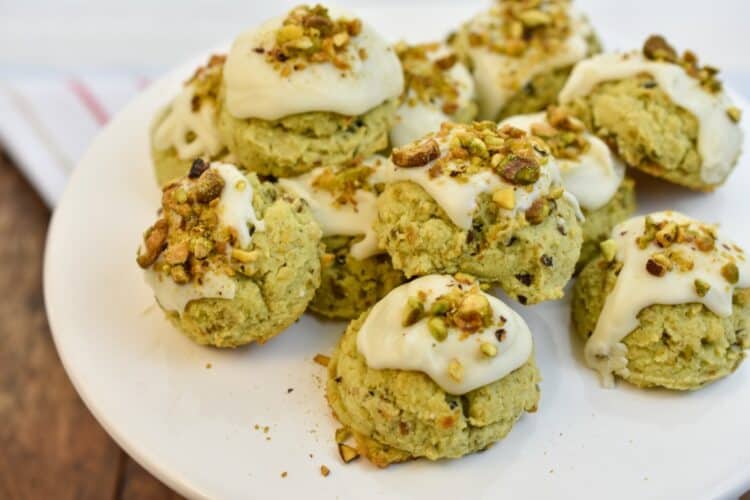 keto pistachio cookies on a white stand