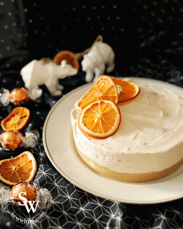 cinnamon and orange cheesecake topped with dried orange slices.