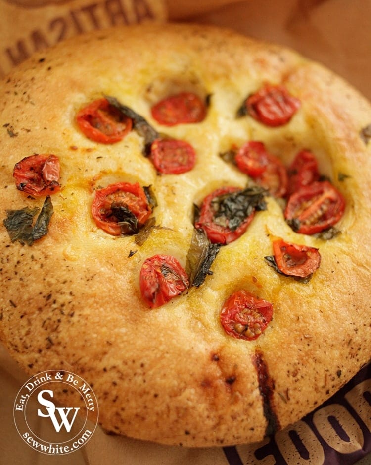 Golden brown focaccia studded with cherry tomatoes.