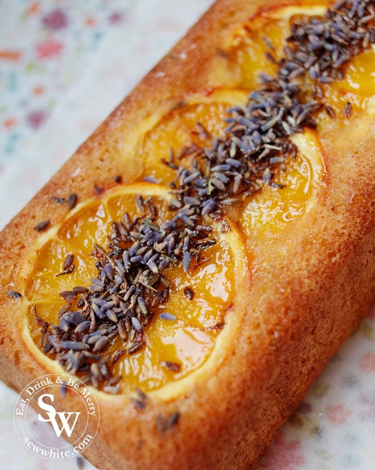 Glistening orange drizzle on the Orange Lavender Loaf complimented by the purple tones of the lavender.