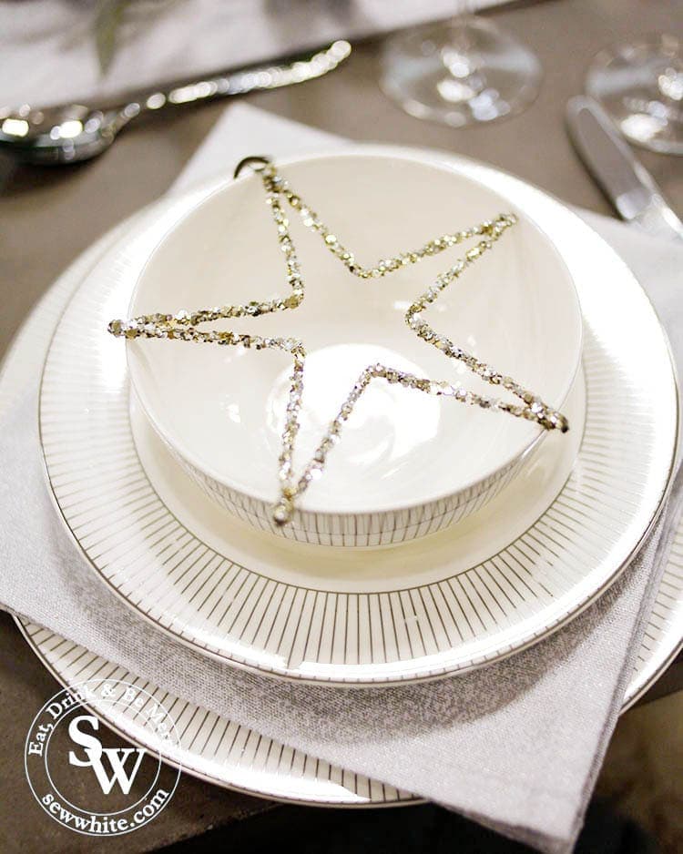 The white company star lent on crockery for a Silver Christmas Table Inspiration