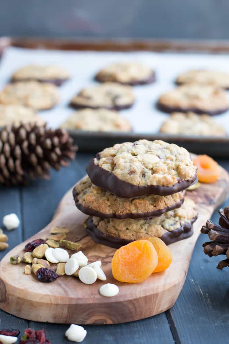 Pistachio Bark Oatmeal Cookies. Chewy oatmeal cookies filled with pistachios, cranberries, white chocolate and apricots then dipped in dark chocolate!