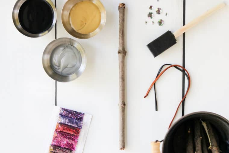 craft supplies for making a diy harry potter wand on white table