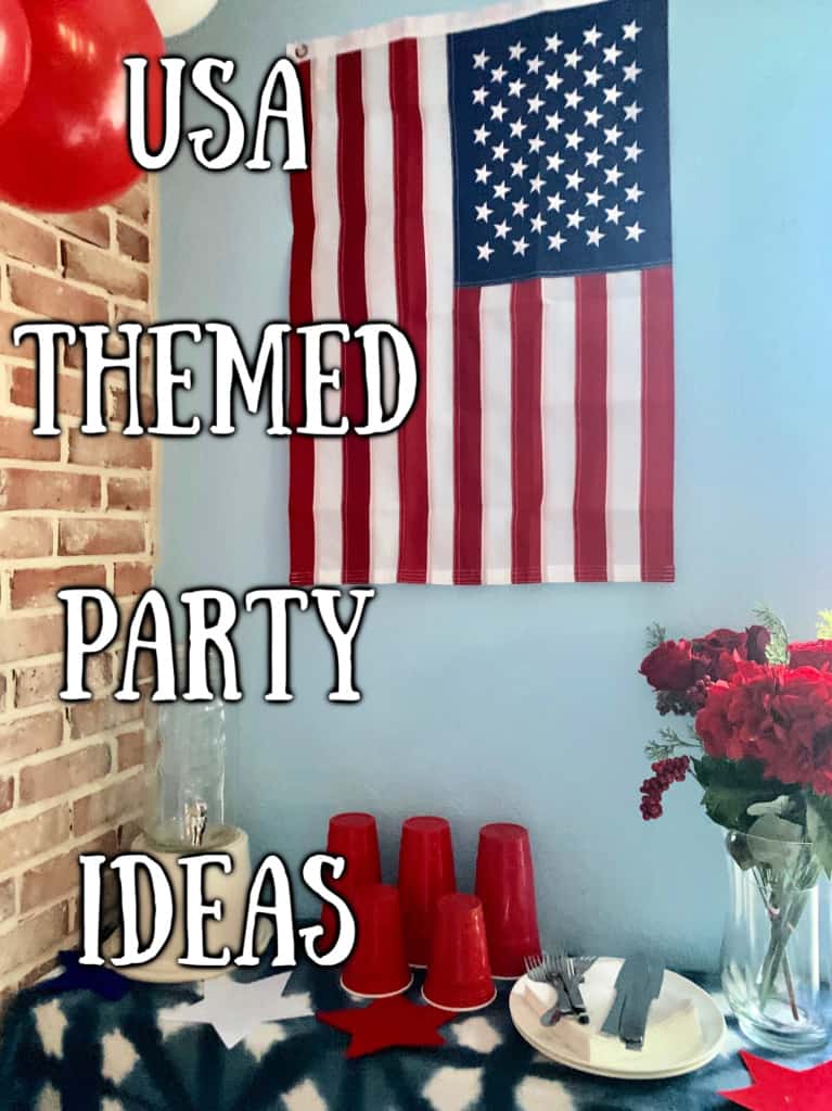 american flag hung over a table with cups and plates