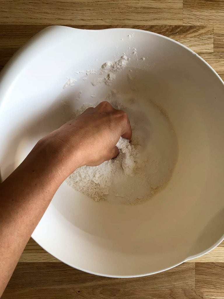 Making coconut crumble topping.
