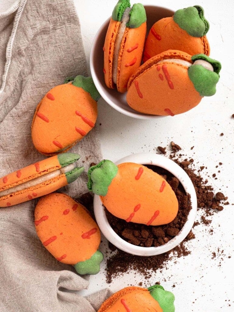 Carrot shaped macarons filled with carrot cake cream cheese buttercream easter cookies