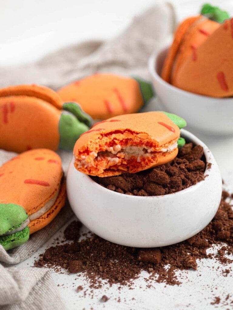 Carrot shaped macarons filled with carrot cake cream cheese buttercream easter cookies