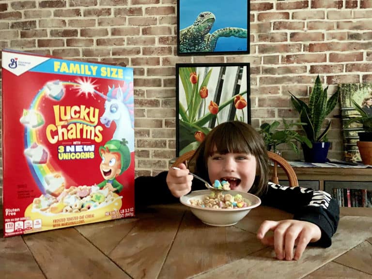 girl eating bowl of lucky charms
