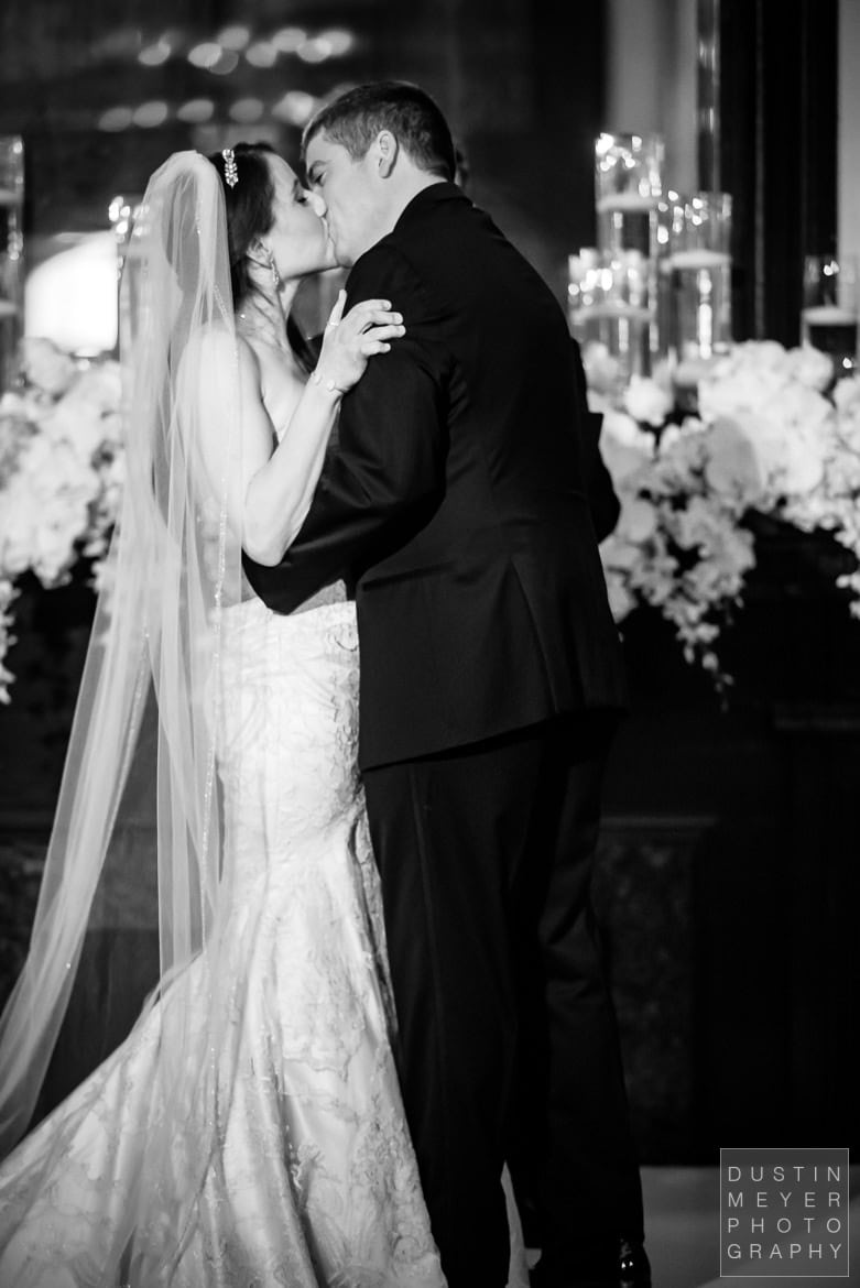 Bride and Groom Kiss at the altar Bride and Groom Kiss at the altar | Driskill Hotel Wedding Austin Wedding Photographers