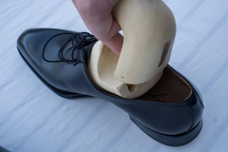 The problem is that the shoe tree is formed after the shape of the foot which is widest at the ball area, which must get through the slimmer instep of the shoe, which can be a bit tricky and often the shoe is stressed quite a bit here. When one insert the trees you often do it in the same way, creating the same problem again.
