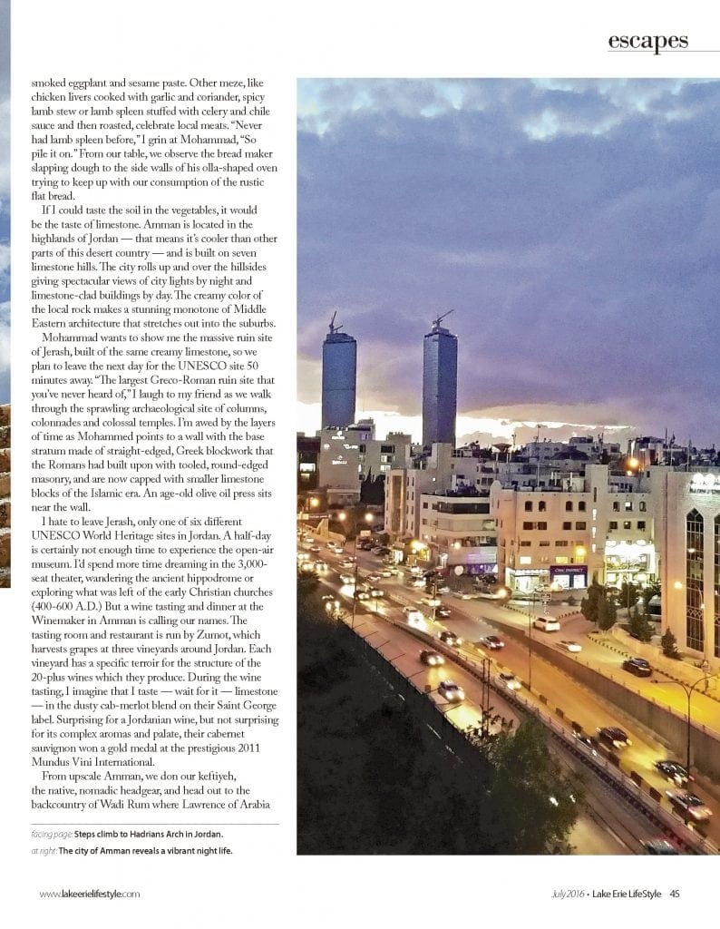 Magazine page with photo of sunset over downtown Amman