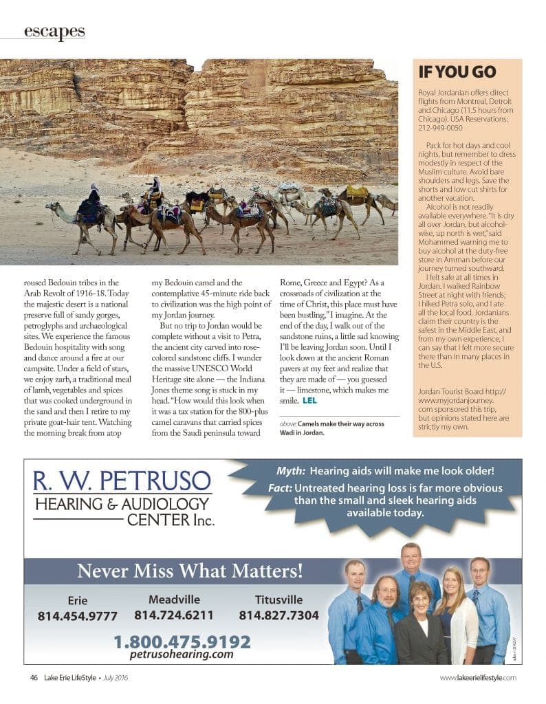 Magazine page with photo of camel caravan in Jordan desert