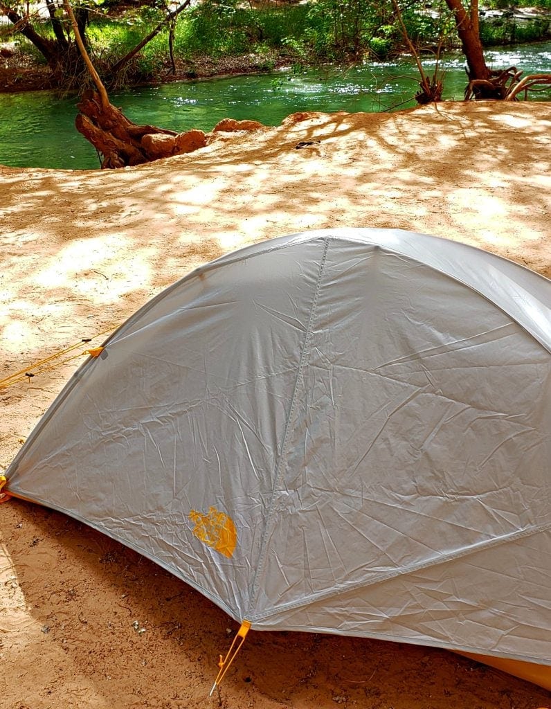 Small backpack tent pitched next to Havasu Creek