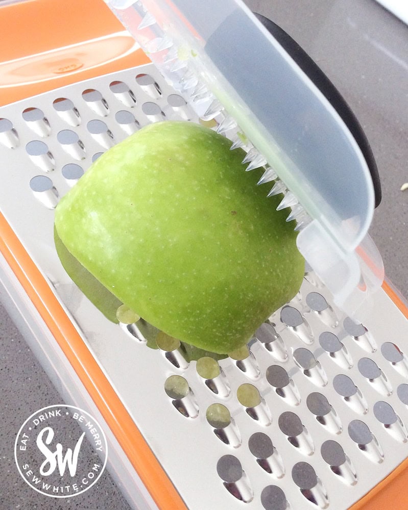 grating apple on the OXO grating set for the apple panckes