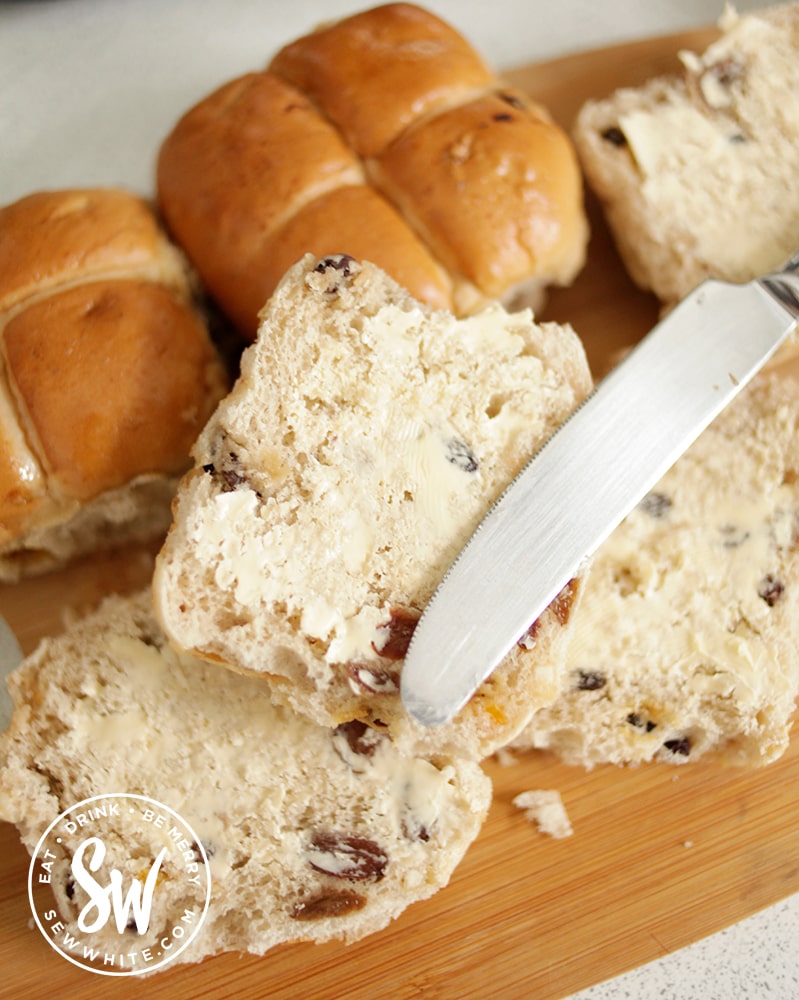 Hot Cross Bun Dessert - slicing up the hot cross buns and buttering them