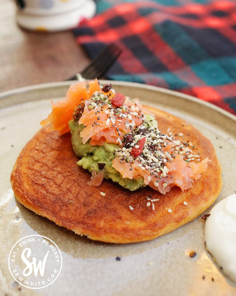 Savoury pancake idea with smoked salmon, guacamole and seeds
