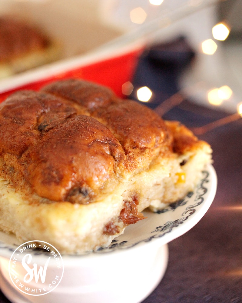 Close up of the Hot Cross Bun Dessert cooked in a bread and butter pudding batter dusted with cinnamon