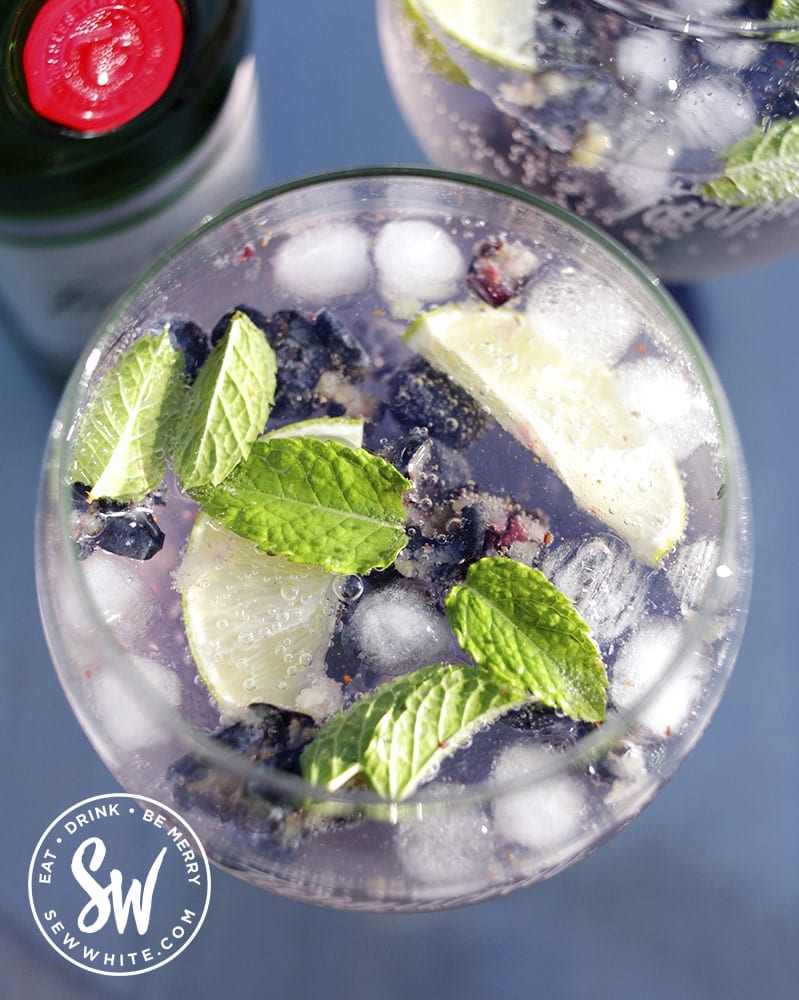 a top view of the blueberries, mint and lime for the Blueberry Gin and Tonic Recipe