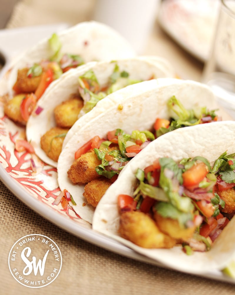 Healthy and fresh Mexican fish finger wrap on a plate.