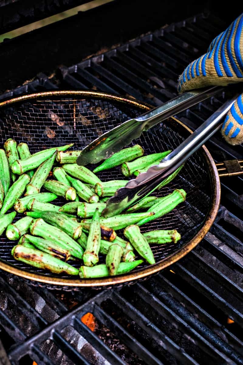 A pan of food on a grill, with Okra