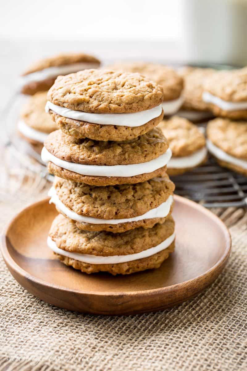 Oatmeal Cream Pies - soft, chewy oatmeal cookies with hints of cinnamon, molasses and coconut, with a sweet marshmallow cream filling. www.savingdessert.com