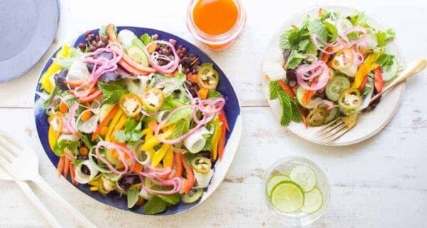 Colorful Bánh mì Salad with carrot ribbons, thinly sliced peppers, pickled onions and lots of herbs served with Sriracha Vinaigrette || @thismessisours